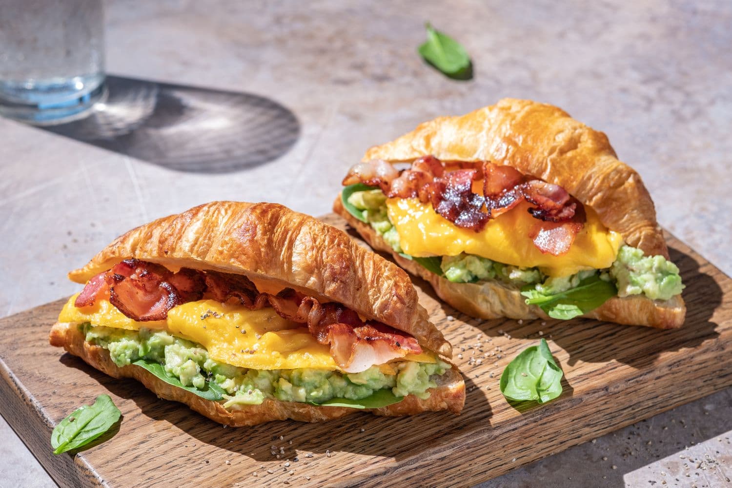 A spread of fresh croissants and eggs prepared for a Cafe 33 catering order